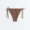 Bikiny se středním krytím a vázáním s mini puntíkovaným potiskem Bikiny se středním krytím a vázáním s mini puntíkovaným potiskem