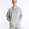 Dlouhá melírovaná bundy s kapucí Dlouhá melírovaná bundy s kapucí