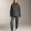 Oversize bundy z umělých kožichů s kapucí podšitou umělou kožešinou Oversize bundy z umělých kožichů s kapucí podšitou umělou kožešinou